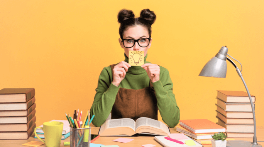 female student revising at colourful, quirky desk